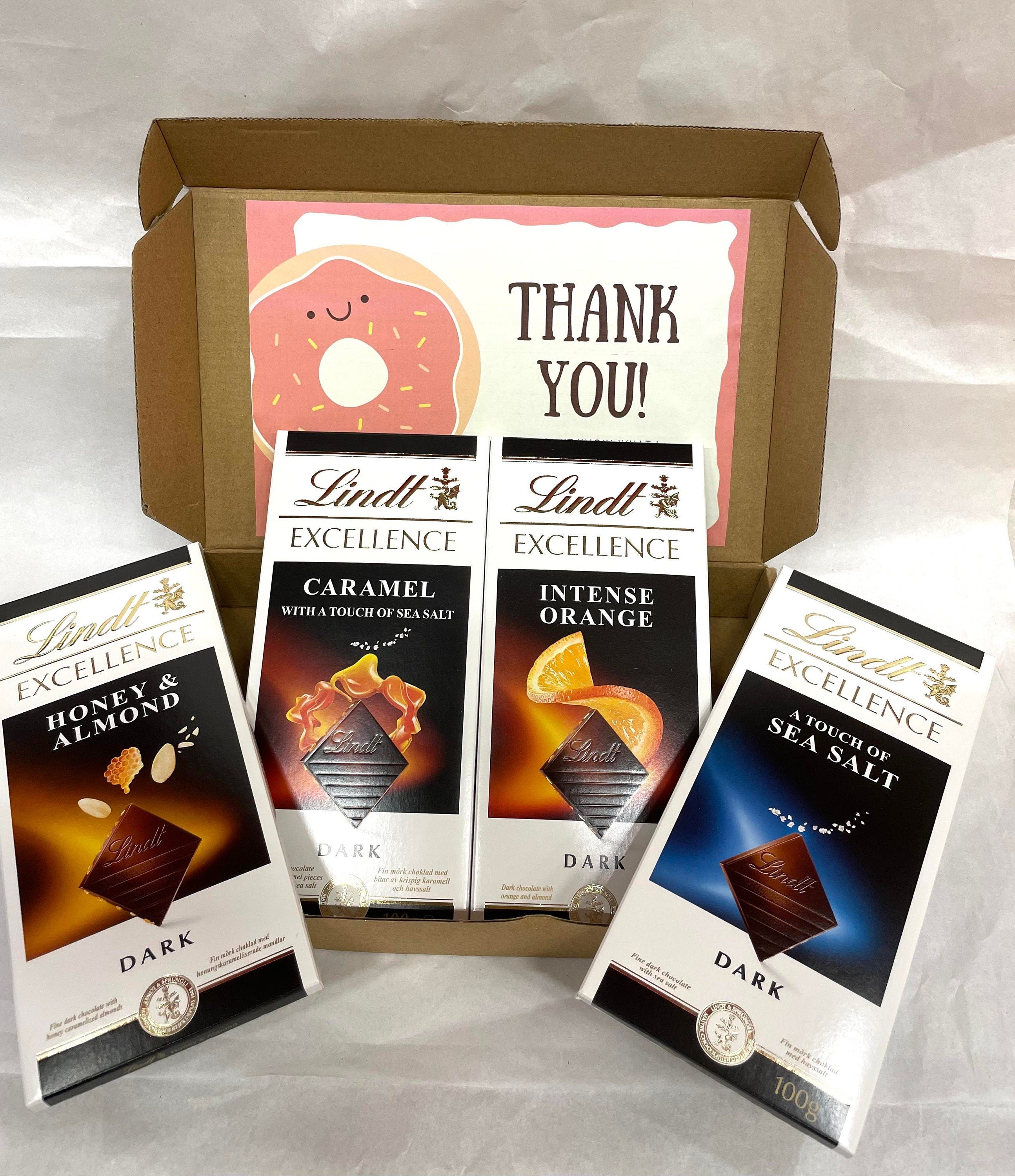 Open Lindt Excellence dark chocolate gift box standard size with four 100g bars and personalized greeting card