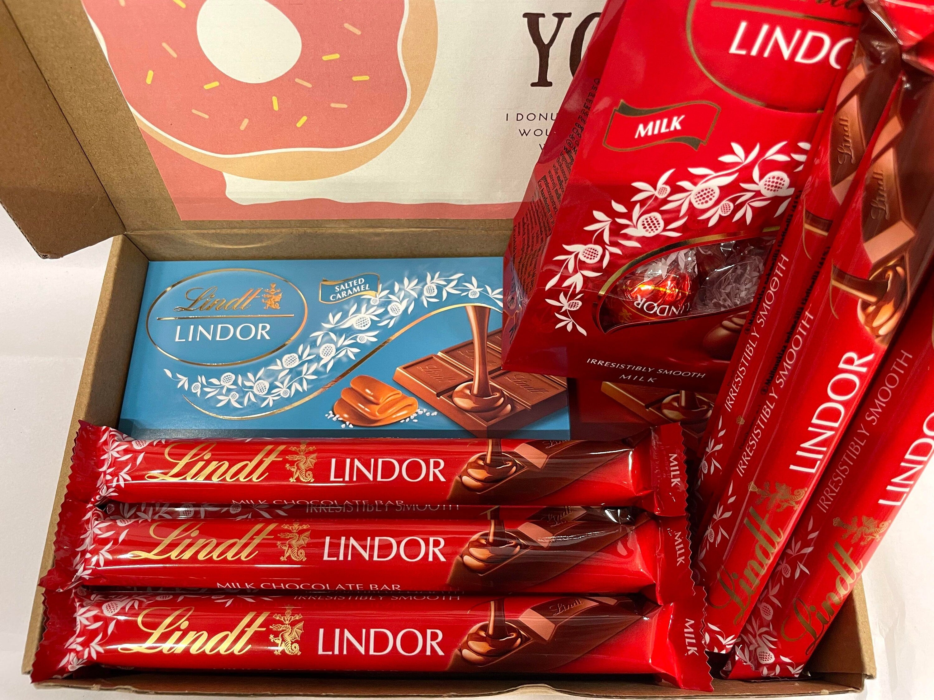 Lindt Lindor milk chocolate gift box heavy size containing twelve 40g sticks, two 100g bars, and one 110g eggs pack